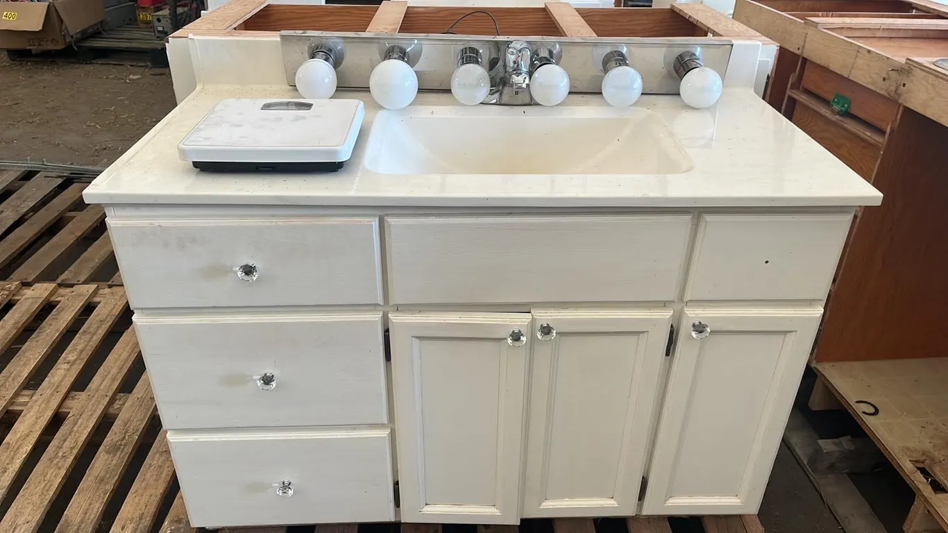 OFFSITE - Bathroom vanity with vanity lights , medicine cabinet and scale. 47” long, 22” deep and 32” high to top of counter.
