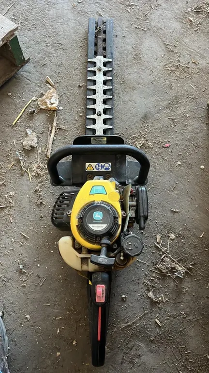 OFFSITE - John Deere pro series gas powered hedge trimmer, model H200D LE, needs carb work.