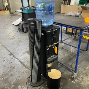 Primo Water Cooler, Space Heater, and Trash Can
