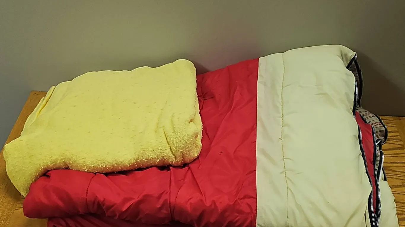 Red and Cream Reversible Sleeping Bag with Yellow Blanket
