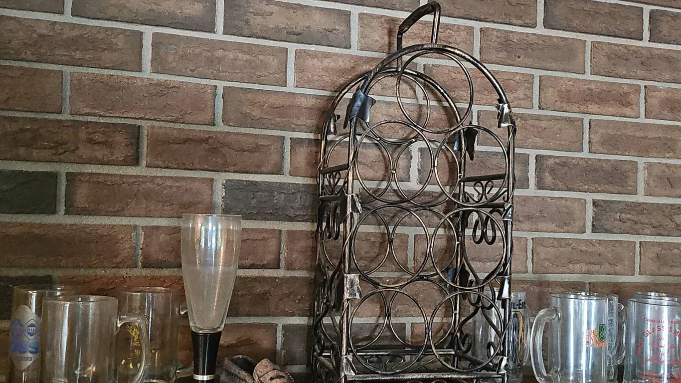 Metal Wine Rack With Assorted Beer Mugs and Glasses