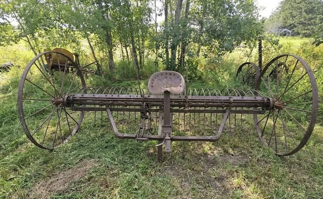 Antique Metal Horse-Drawn Farm Implement with Iron Wheels