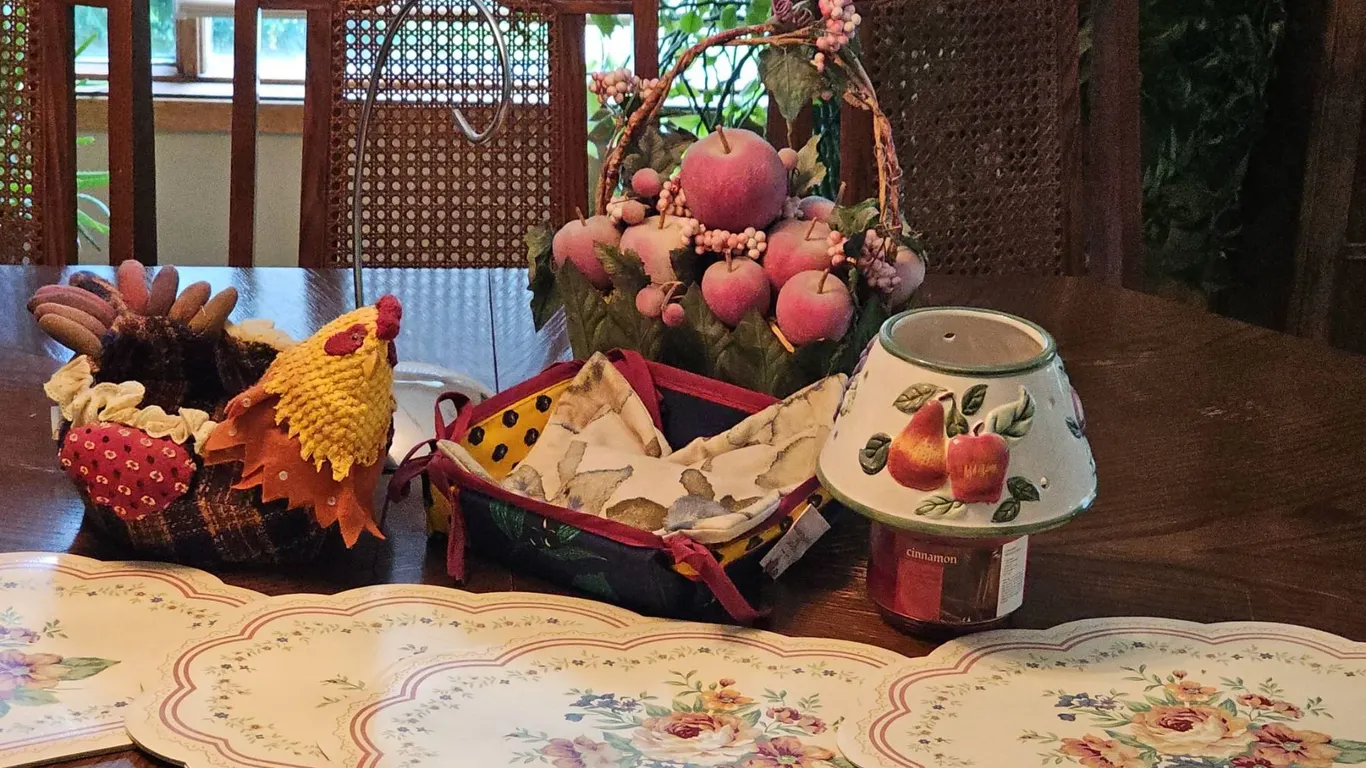 Kitchen Decor Lot With Placemats, Fabric Chicken Basket, Fruit Basket, and Candle Lamp