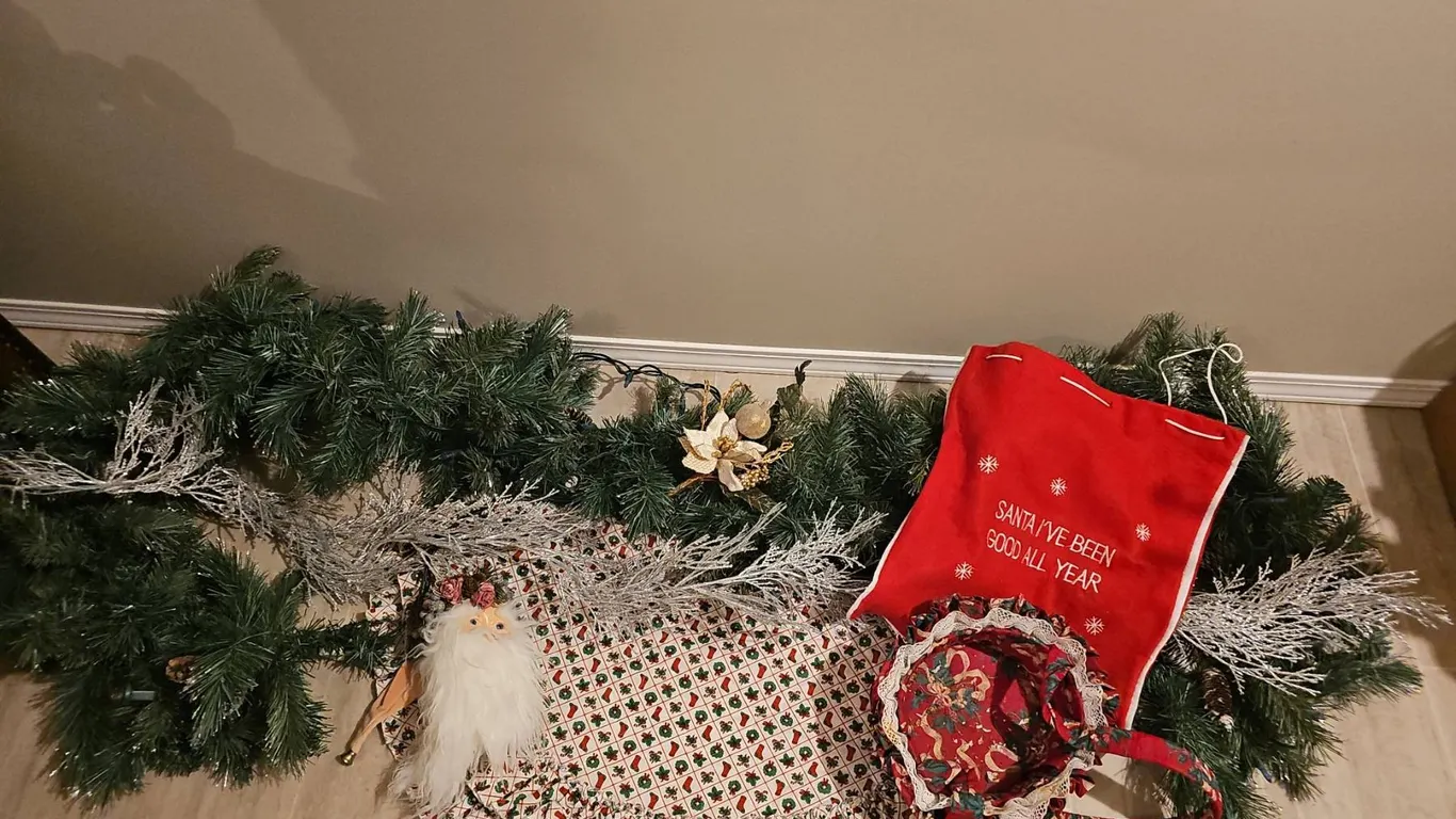 Holiday Décor Lot With Garland, Santa Sack, and Table Linens