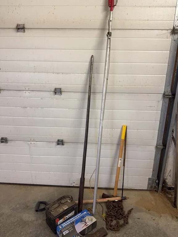 Tools and Utilities Including UniPower Battery, Axe, Pole Pruner, and Chain