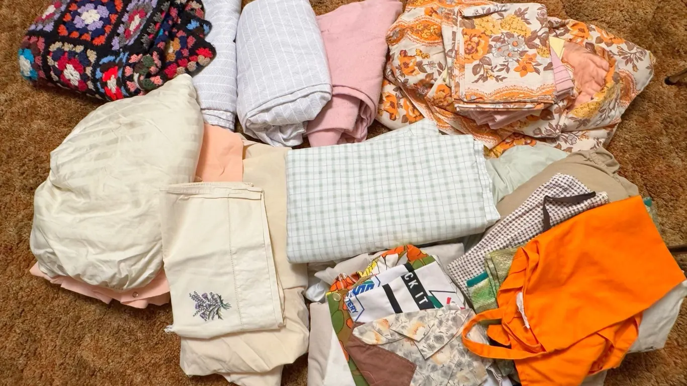 Linens and Textiles Including Crochet Afghan and Floral Sheets