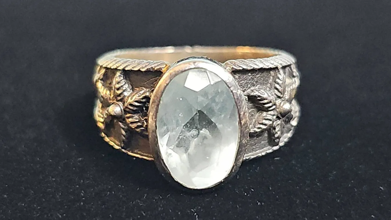 Sterling Silver Ring with Oval Faceted White Stone and Floral Band