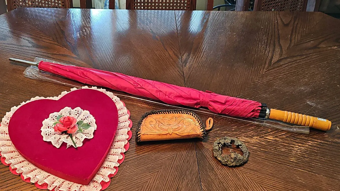Lot: Heart-Shaped Velvet Box, Tooled Leather Coin Purse, Decorative Metal Plaque, and Red Umbrella