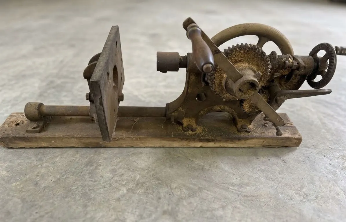 Cast Iron Hand-Crank Gear-Driven Machine Part on Wooden Base