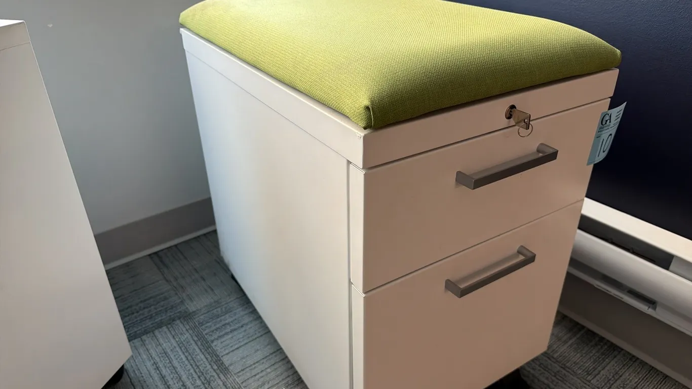 Filing cabinet on wheels with upholstered top, key, 15.5” wide x 22.5” deep x 25” tall