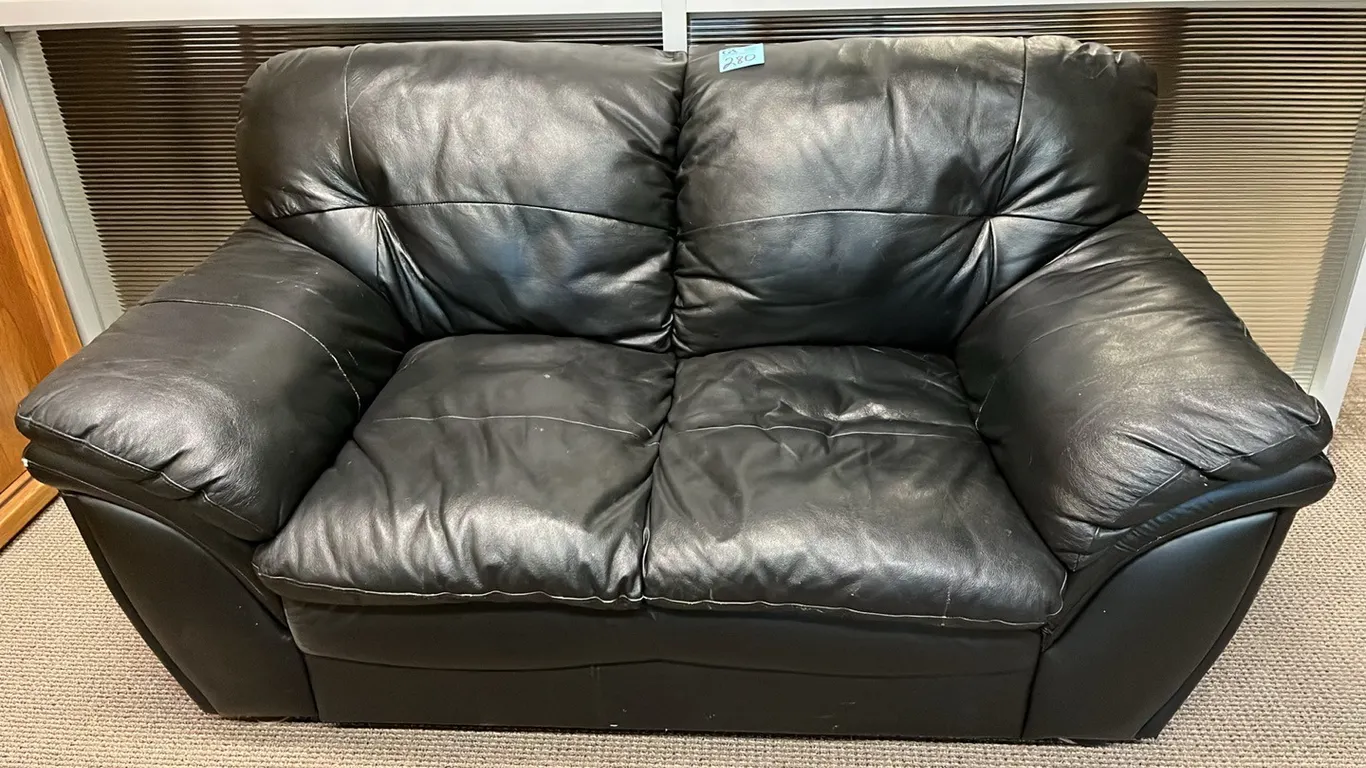 Black Leather Loveseat 66” wide, 36” deep, 36” height