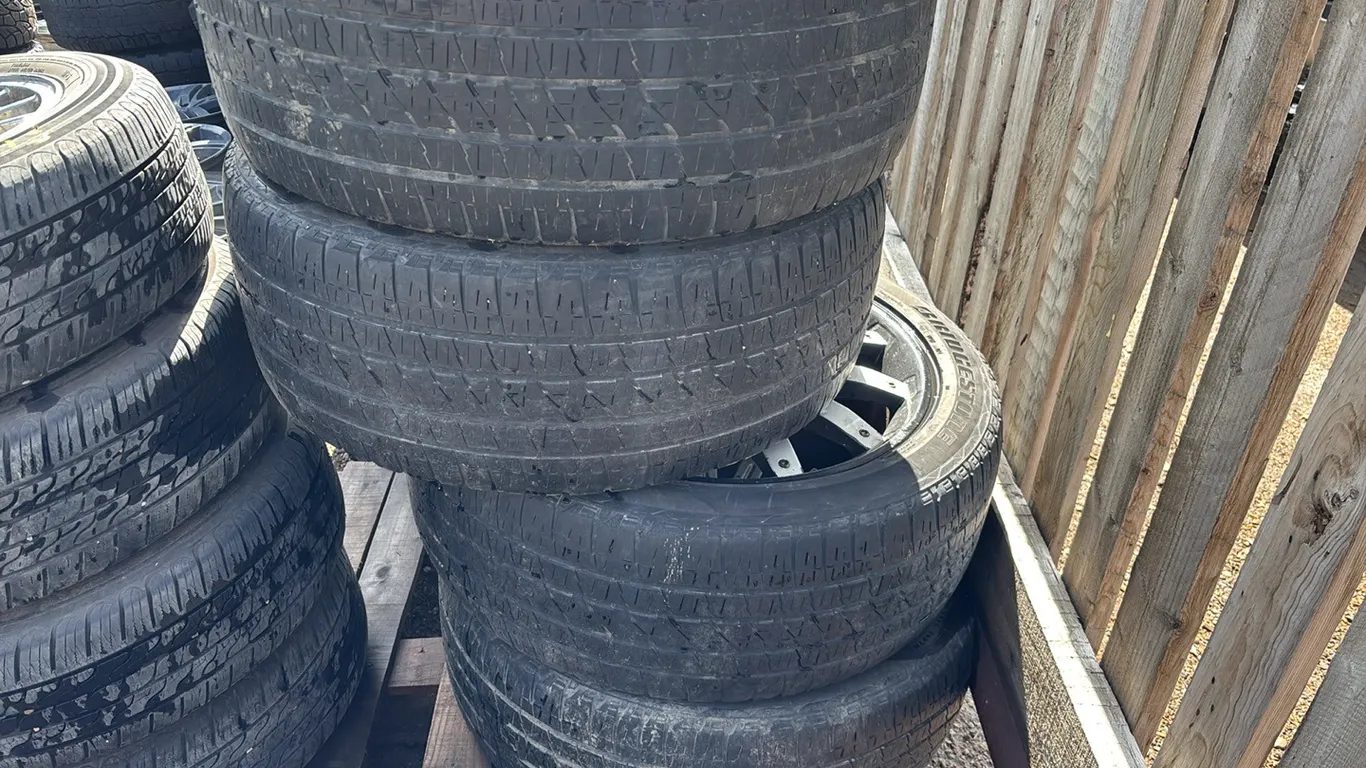 (4) Bridgestone 285/45R22 Tires and Rims for Cadillac