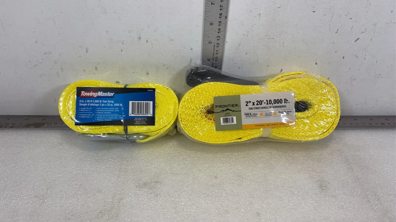 Lot of 2 Tow Straps, 1 Strap is 2" x 20ft x 2000lbs, 1 Strap is 2" x 20ft x 10,000lbs, approx. Dimensions of Lot 8 1/2" x 4" x 4 1/2&#