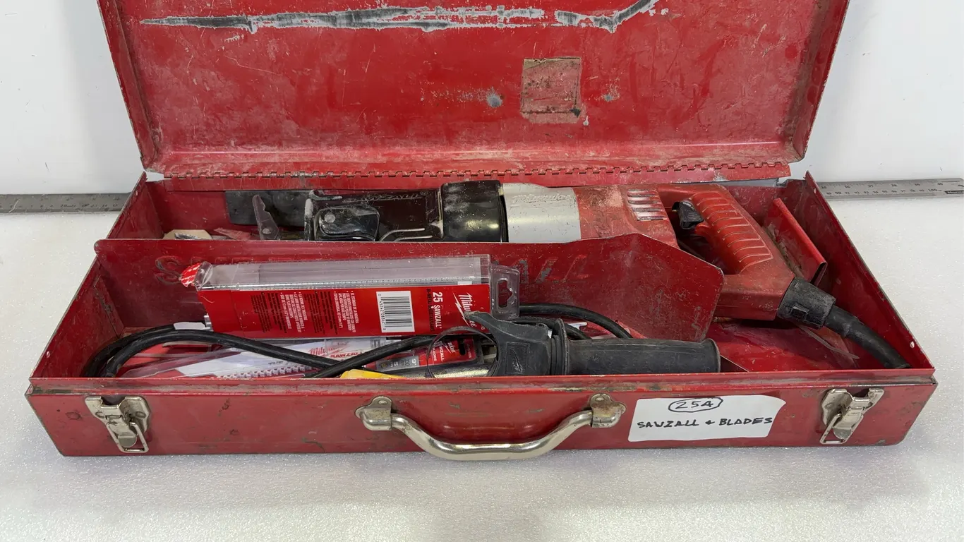 Milwaukee Sawzall, Working Condition, with Box of 9" Blades approx. 8 pce, approx. Dimensions of Lot 24" x 10 1/2" x 4 1/2" *Unreserve