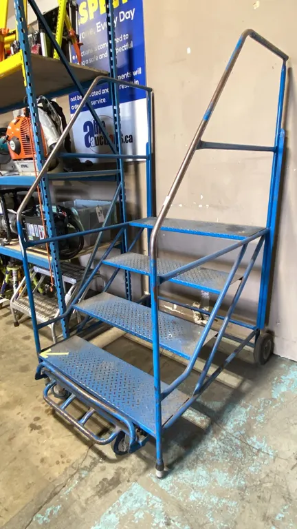 BLUE MOBILE 4 STEP WAREHOUSE STAIRS APPROX 38"W X 48"D X 72"H TO TOP OF HANDLES, 36"H TO TOP STEP