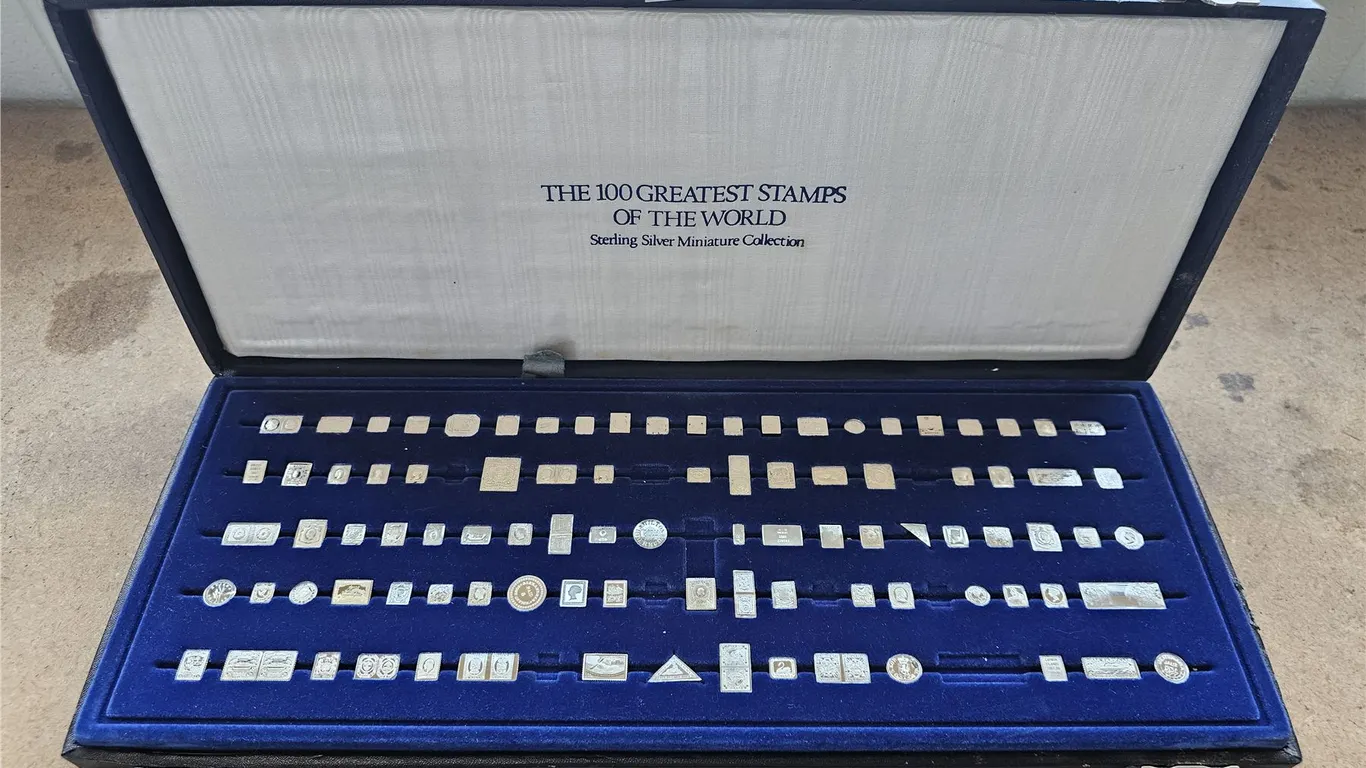 CASE OF STERLING SILVER MINIATURE WORLD STAMPS *COLLECTION IS NOT COMPLETE*