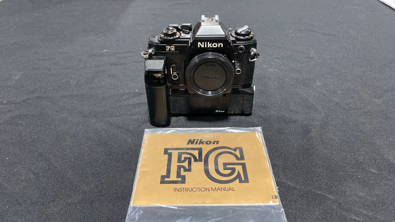 NIKON FG 35MM FILM CAMERA WITH NIKON MD-14 BATTERY POWERED MOTOR DRIVE