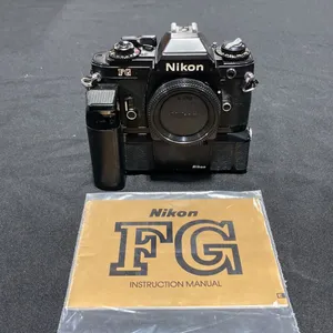 NIKON FG 35MM FILM CAMERA WITH NIKON MD-14 BATTERY POWERED MOTOR DRIVE
