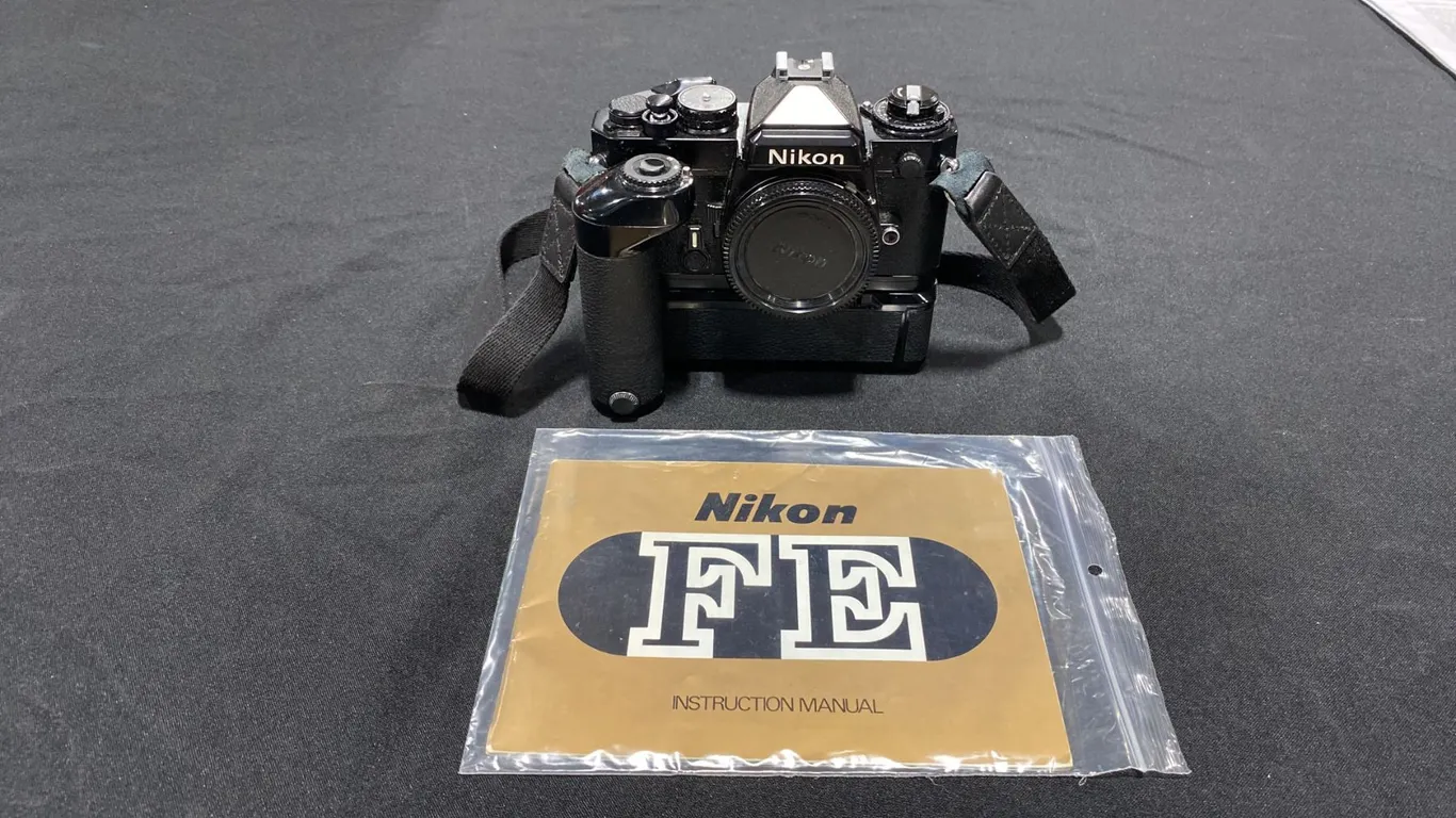 NIKON FM 35MM FILM CAMERA WITH NIKON MD-12 BATTERY POWERED MOTOR DRIVE