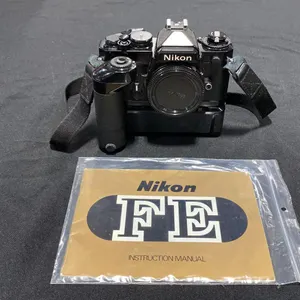 NIKON FM 35MM FILM CAMERA WITH NIKON MD-12 BATTERY POWERED MOTOR DRIVE