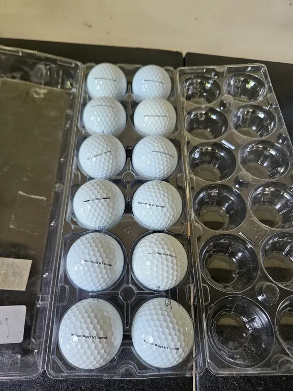 12 used Titleist Pro V1 golf balls in case