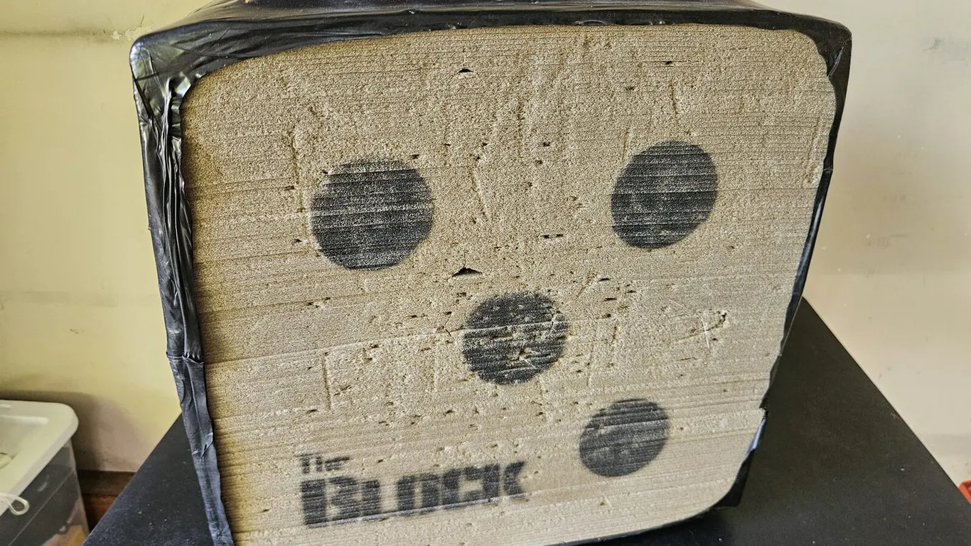 The Block foam crossbow target with Boulder arrow removal tool