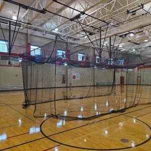 LynRus QR3 ceiling-suspended motorized retractable batting cage system. Includes netting, frame poles, mounting brackets, pulleys, cables, and electri