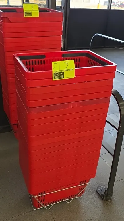 Poly shopping baskets. Features red molded plastic construction with dual folding handles and vented sides and bottom. 17"W. Includes wire floor stand
