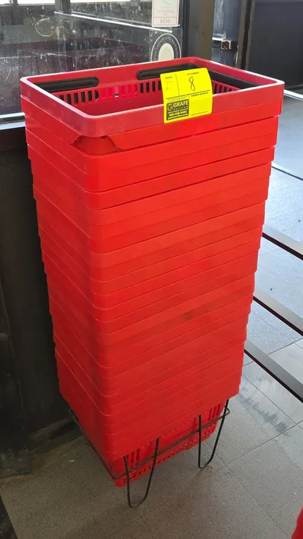 Poly shopping baskets. Features red plastic construction with dual folding black handles and vented grid design. 17"W. Includes black wire floor stand