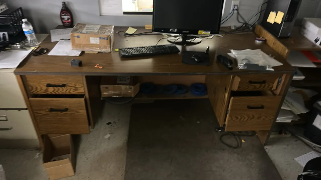 Office furniture lot. Includes wood laminate double-pedestal desk, metal 2-drawer file cabinet, tall laminate bookcase, 2-door storage cabinet, open l
