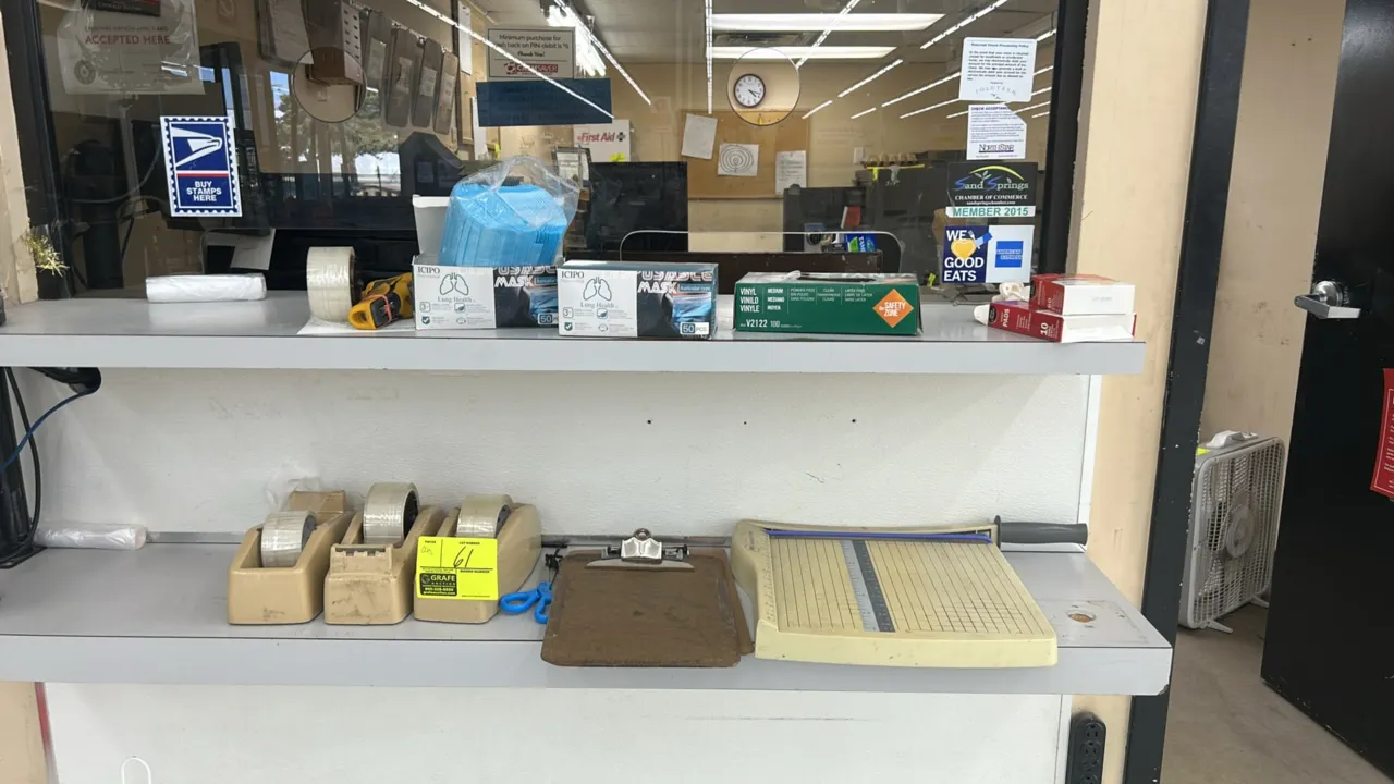 Assorted office and counter supplies. Includes a GBC ClassicCut guillotine paper trimmer, (3) desktop tape dispensers, clipboards, scissors, disposabl