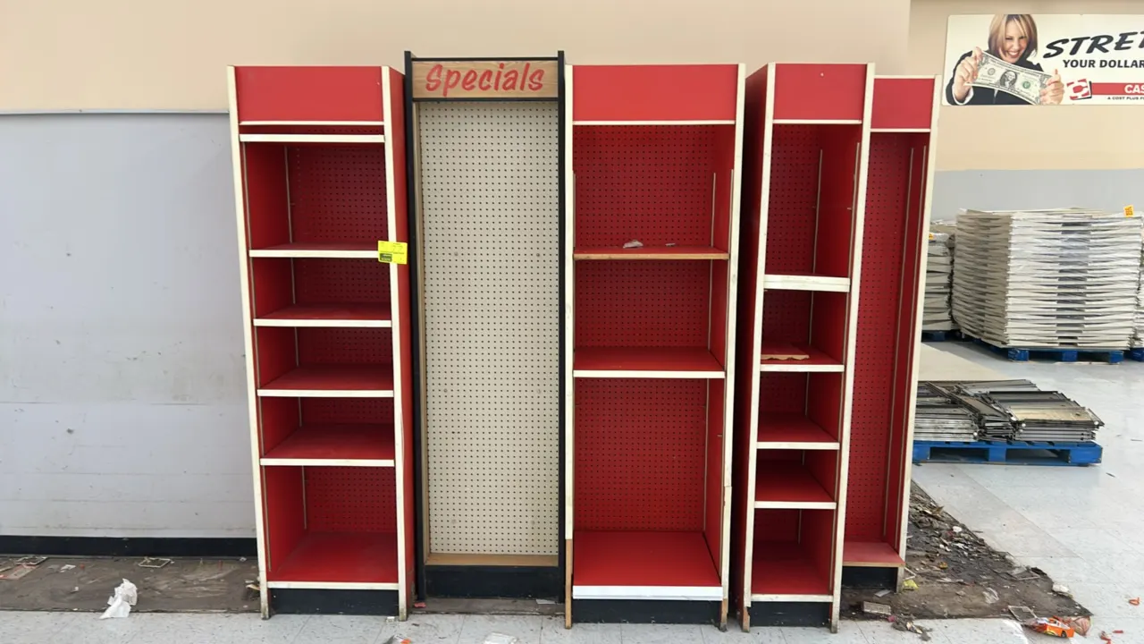 Laminate retail display shelving units. Includes (5) upright display fixtures featuring red laminate construction with white edge trim, pegboard back