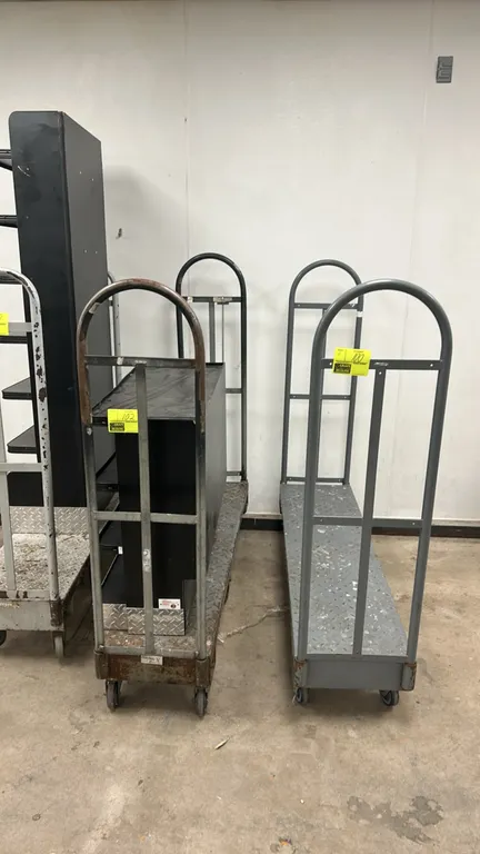 Metal diamond plate U-boat platform carts. Features diamond plate steel decks and dual tall tubular end handles. 5'L. Mounted on center wheels with sw