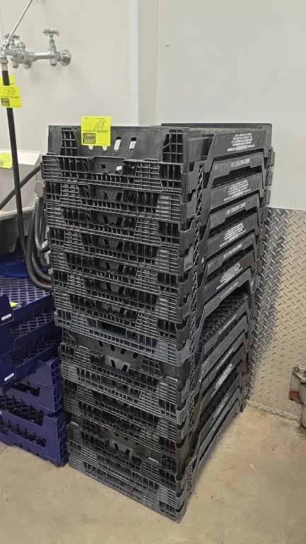 Poly bread crates. Molded black plastic construction marked Bimbo Bakeries USA. Features ventilated mesh bottoms and sides, integrated handles, and a