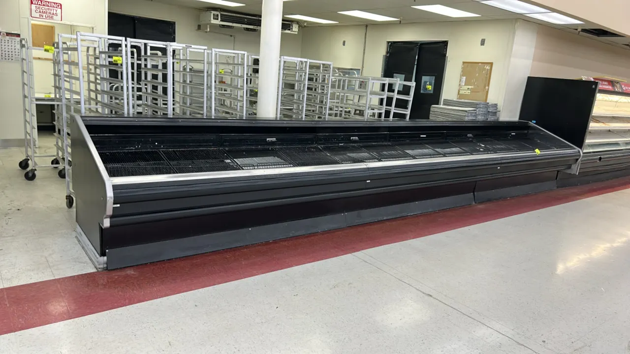 Hussmann refrigerated grab-and-go merchandising cases. Features open front display, wire rack deck inserts, and protective front bumper rail. 8'L each
