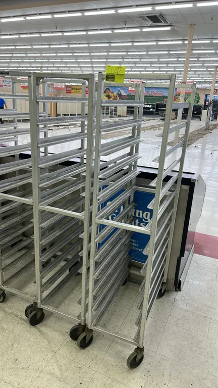 Aluminum front-load meat platter racks. Features welded aluminum frame construction and multi-tier angle slide runners. Mounted on swivel casters.