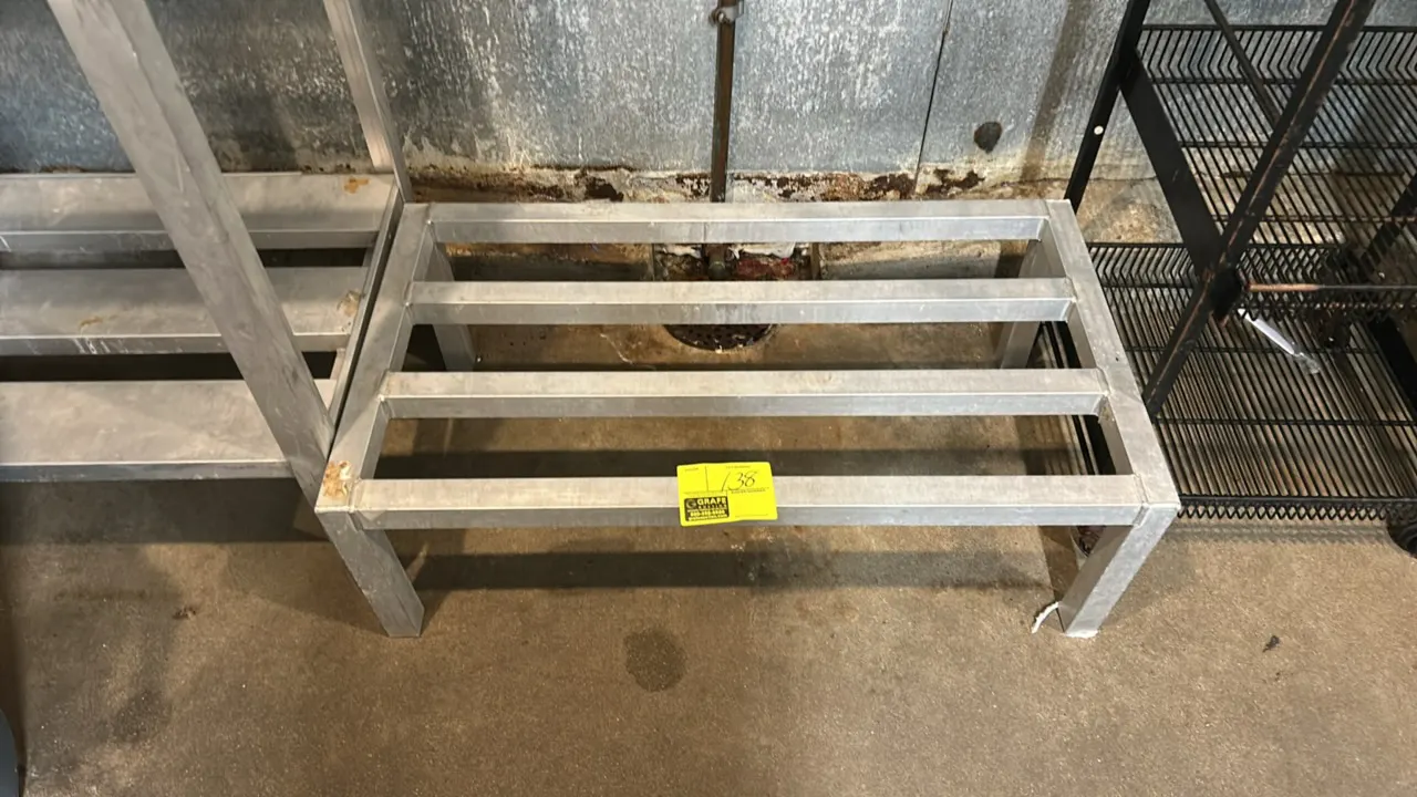 Metal dunnage rack. Features welded tubular construction with a slatted top. 3'L.