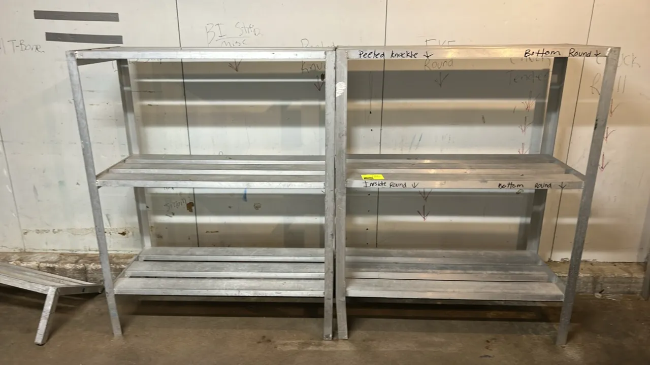 Metal 3-tier racks. Features welded tubular construction with slatted shelving surfaces. Dimensions: 48" x 20".