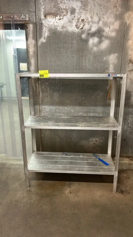 EMI 3-tier aluminum storage racks. Features welded aluminum construction with 3 slatted shelf tiers. NSF certified. 48"L x 20"W.
