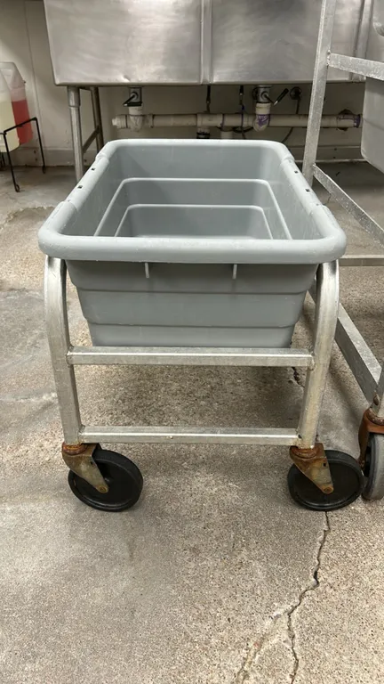 Aluminum bus tub cart. Includes (1) gray poly bus tub. Features a tubular aluminum frame. Mounted on swivel casters.