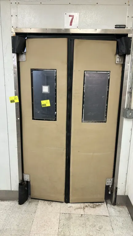 Foam panel walk-in cooler. Features double poly swing doors with view windows, SmartSpeed 2-fan evaporator coil, and interior lighting. Dimensions: 13