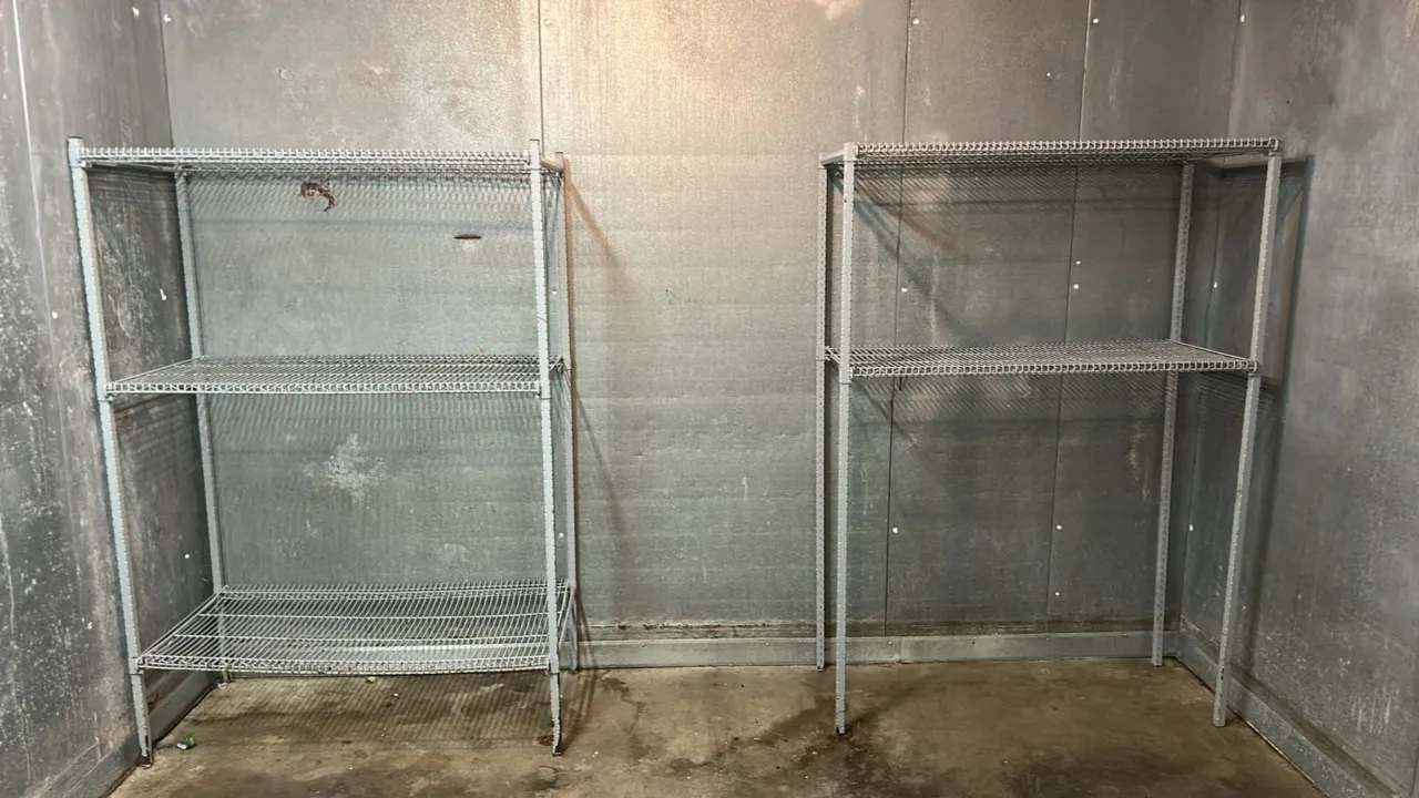 Metal wire shelving racks. Includes (1) 3-tier unit and (1) 2-tier unit. Features open wire construction and adjustable shelf tiers. Dimensions: 4' x