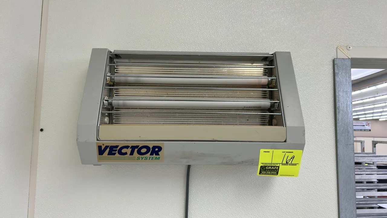 Vector System wall-mounted insect light trap. Features dual UV bulb design and front protective wire grille.