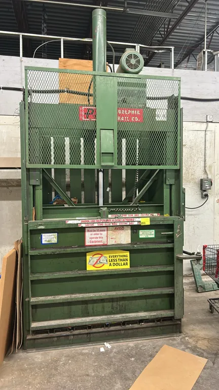 2000 PTR Philadelphia Tramrail 2300HD vertical cardboard baler. Features wire mesh safety gate, handwheel door lock, and hydraulic ram. Feed opening: