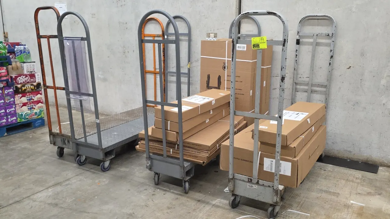 Metal 6-wheel U-boat stocking carts. Features dual tubular steel end handles and steel platform decks. 5'L. Six-wheel configuration with rigid center