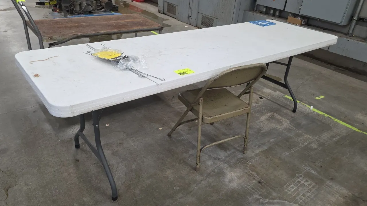 Polyethylene folding table and metal folding chair. Table features an 8'L white molded plastic top on a folding metal leg base. Includes (1) tan metal