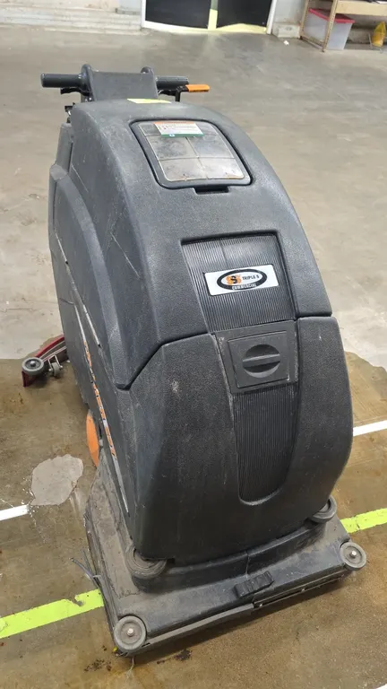 2020 Triple S Panther 26T walk-behind floor scrubber. Features a rear curved squeegee assembly, vacuum recovery hose, and operator control console wit