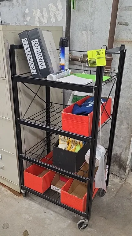 Portable 4-tier metal utility rack. Features black metal construction with wire shelves. Dimensions: 2' x 4'. Mounted on swivel casters. Contents not