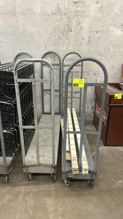 Metal diamond plate U-boat platform carts. Features diamond tread decks and dual tubular end handles. 5'L. Mounted on casters. Contents not included.
