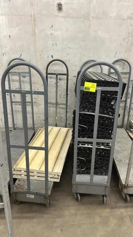 Metal diamond plate U-boat stock carts. Features steel diamond plate decks and tubular steel handles. 5'L. Mounted on casters. Contents not included.